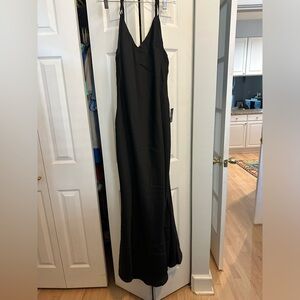 Lulu’s black backless slip dress size M brand new. NEVER WORN. Tags still on.